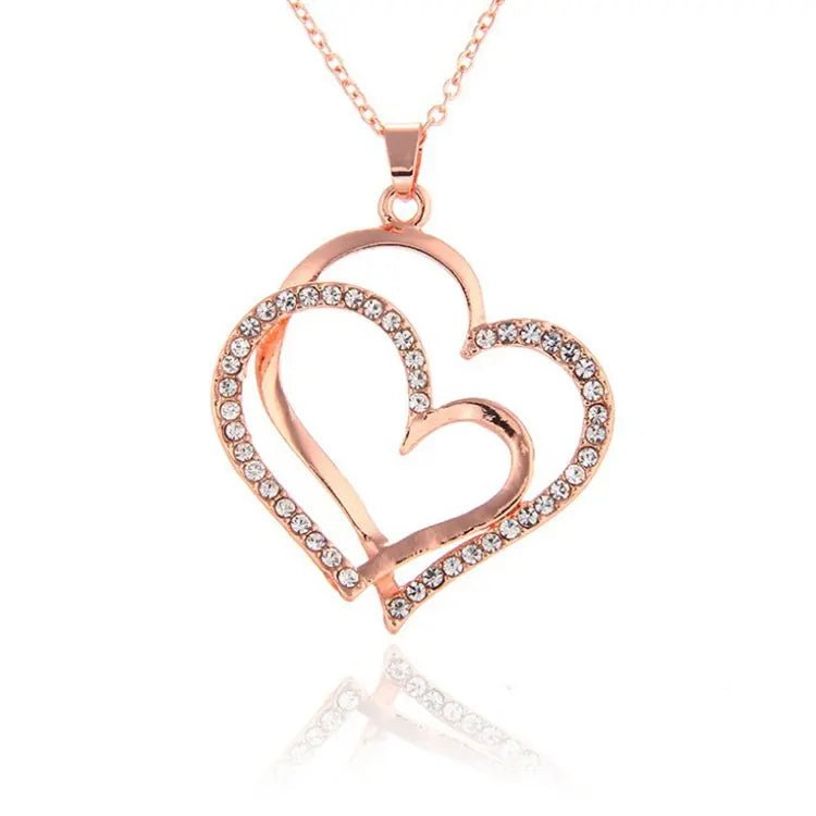 Interlocking Gold Hearts - Downtown Girl